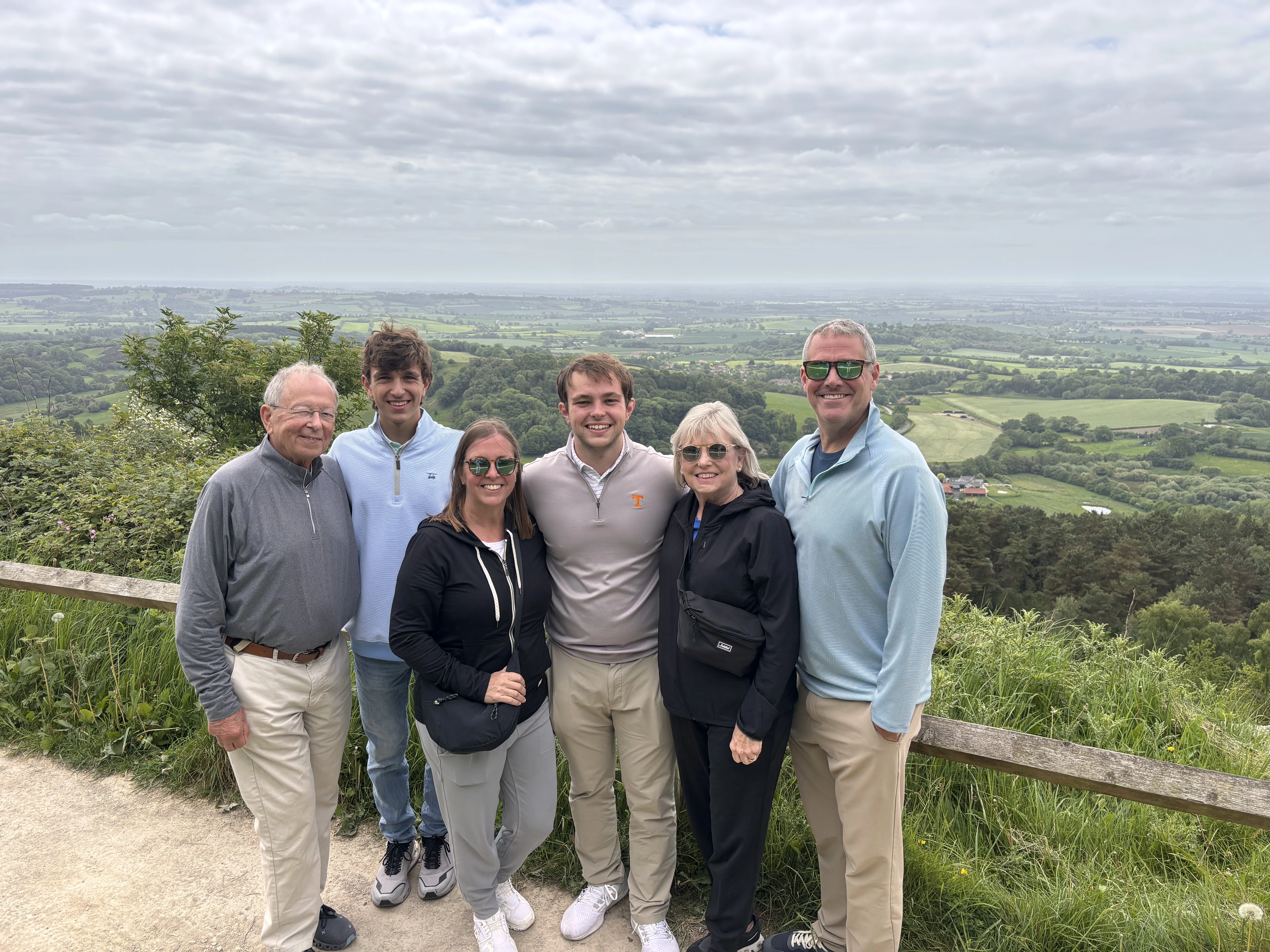 A family of all ages enjoying an easy viewpoint at Sutton Bank